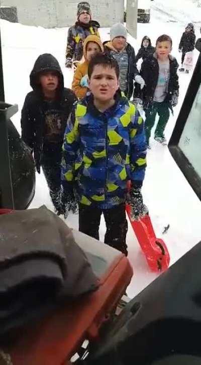Kids ask the snowplow dude not to do it so that they can keep enjoying it. He doesn't disappoint.