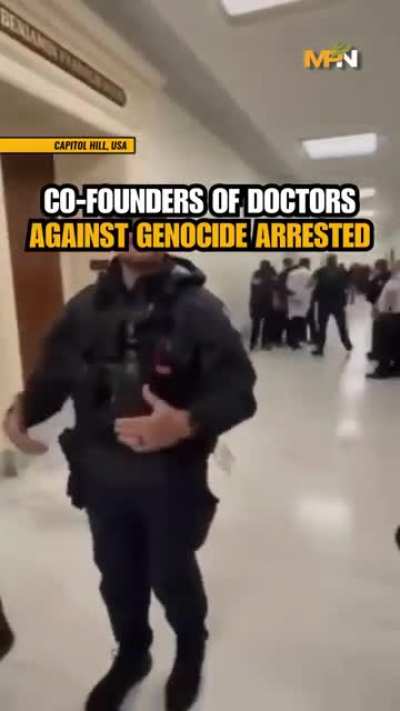 The 2 doctor co-founders of DAG - Doctors Against Genocide, getting arrested in DC for speaking about 2 million people being starved and bombed.