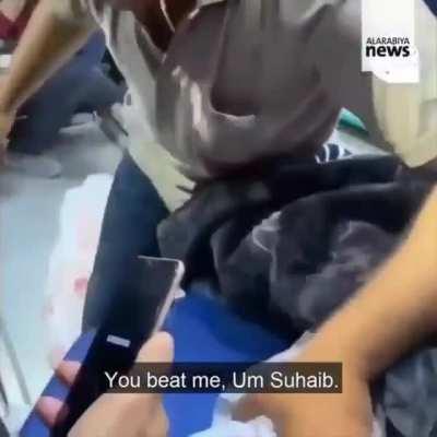 Abu Suhaib Al-Hadidi bidding farewell to his wife. Israel airstrikes killed his wife and 3 children.