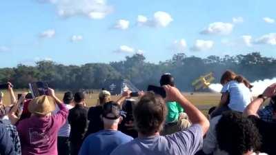 Motorbike backflips over a flying plane. Yes, it's Australia.
