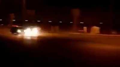 Nighttime drifting ends with light pole collision