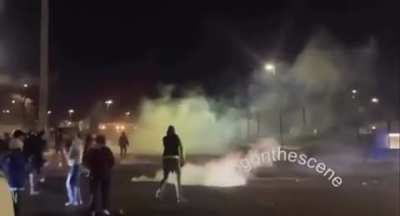 Exchange of fireworks, tear gas, and paintballs at Minneapolis ICE protest.