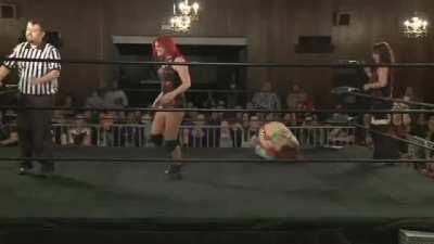 Asuka running kicked in the crotch by Saraya Knight