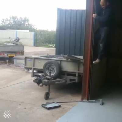 Man successfully avoids stepping on wet paint.