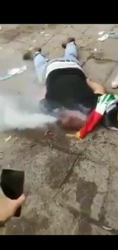 An Iraqi protester was hit by a tear gas canister directly to his head.