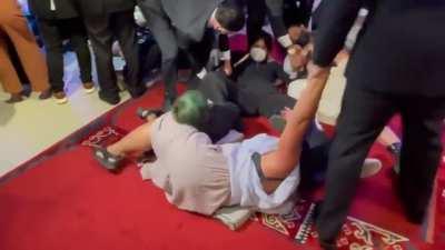 Marcos critics stage a protest inside the Asia Society headquarters in New York where President Ferdinand Marcos, Jr. is set to give a speech