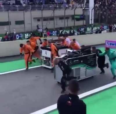 Mercedes & McLaren Pit Crew Member’s Race Down The Pit Lane