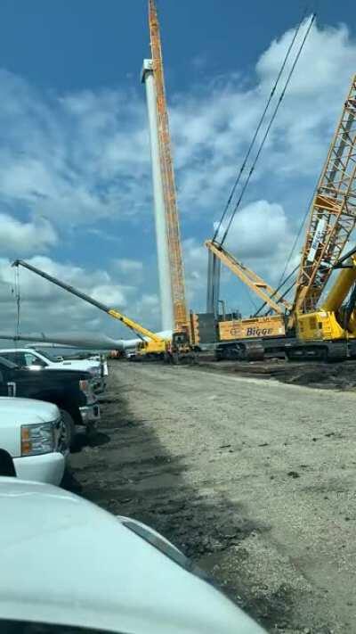 Not sure if this counts. But, we completed a new wind farm today in Iowa. Here is the final tower being topped in a time lapse.