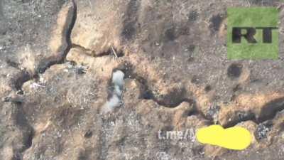 A Russian soldier kills an Ukrainian soldier in a trench at an extremely close range