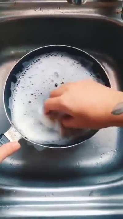 waves hitting his feet