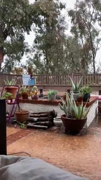 Watching the rain with my best little man from the patio hammock
