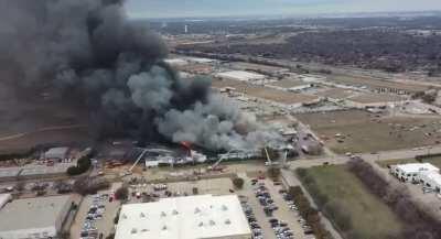 Drone footage of foam recycler factory on fire in North Richland Hills, TX, USA. February 2021
