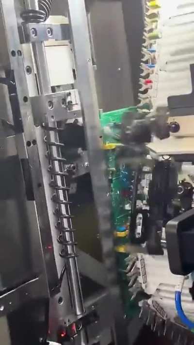 Robotic arm performing Printed Circuit Board Assembly in seconds.