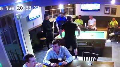Lad gets a pool cue and a 1-2. Dublin pub. (No sound)