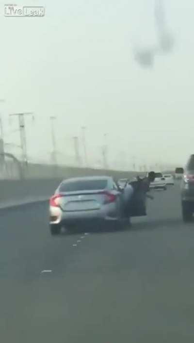 Sticking yourself out a car window to hit another car? Great idea!