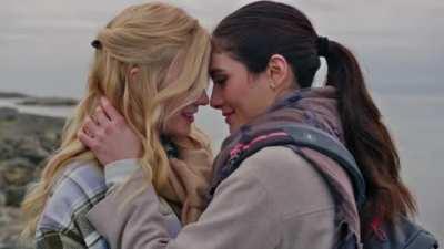 Katherine McNamara kissing a girl