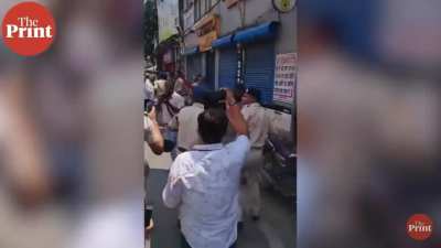 Bihar police beats his senior to stop protests 
