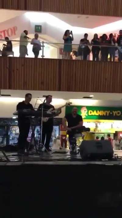 Mall is flooding and the band plays an appropriate song