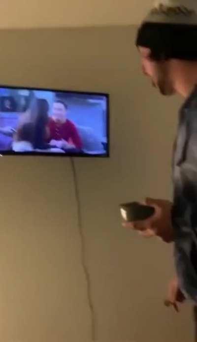 Trying to put a broken TV out of it's misery.