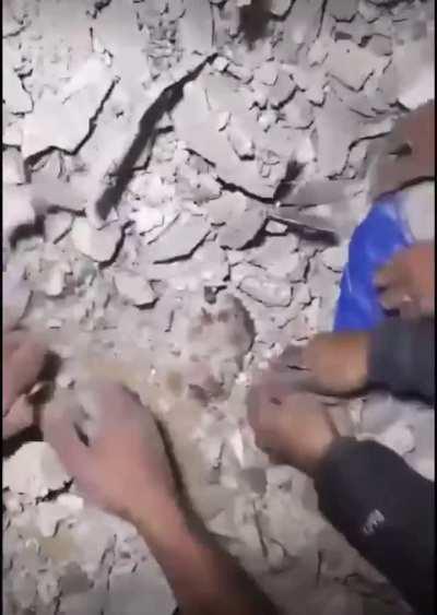 Heartbreaking 💔 Infant girl buried in the rubble in Gaza.