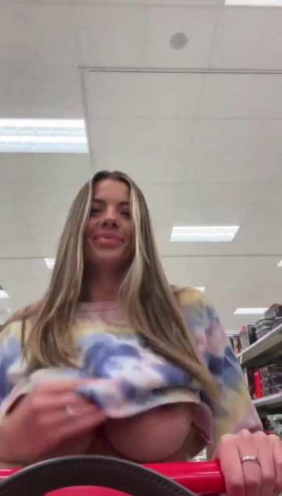 Shopping. Pierced huge tit reveal while shopping..