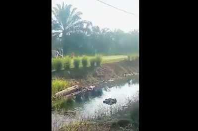 Motorcyclist killed by overtaking car, near Parit Sulong, Malaysia