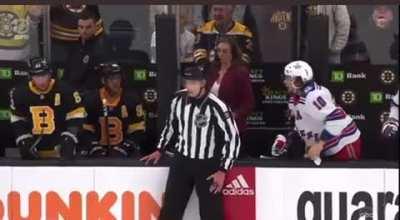 Artemi Panarin throws his glove at Brad Marchand from the bench