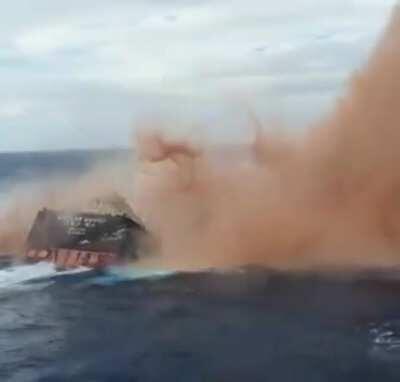 Ship sinking in the ocean.