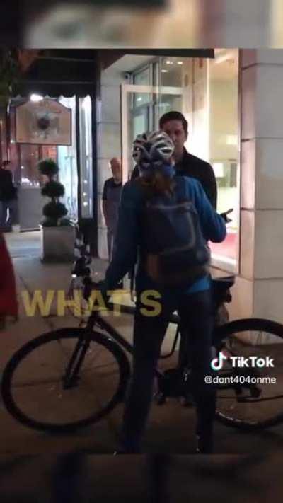 Woman on a bike yelling at a man walking his dog and refusing to let him get by