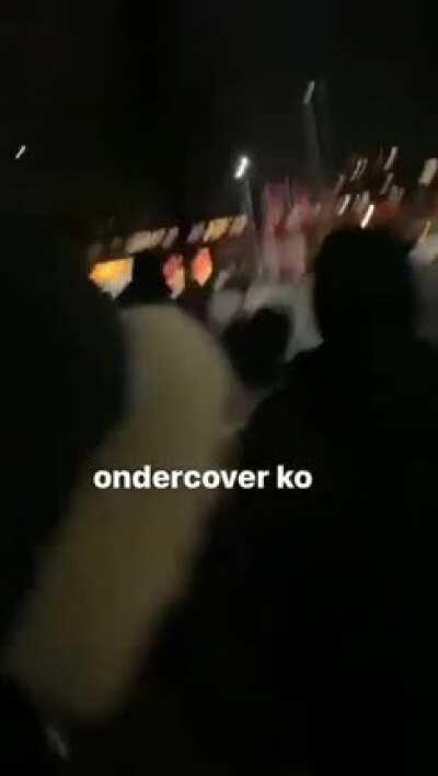 Dutch reporter is knocked out with a stone theres riots because of a evening clock in the netherlands