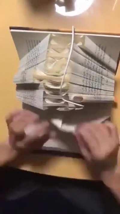 Folding book pages to make the word inspire