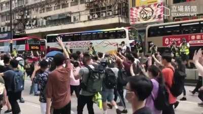 Despite huge police presence, protesters have managed to conduct a march on Nathan Road, shouting 