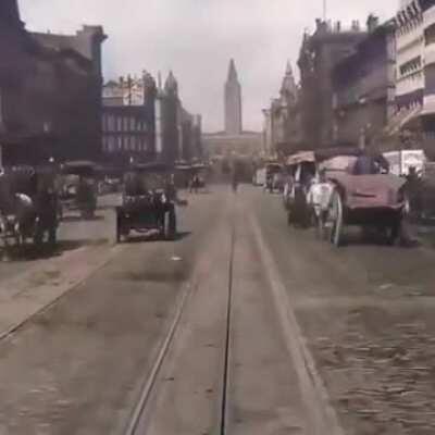 This hundred year old footage of a street car moving through a crowded city