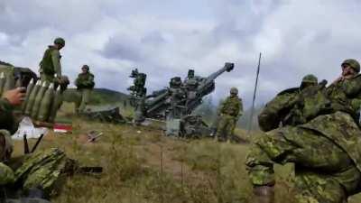 Canadian soldiers waking up their buddy