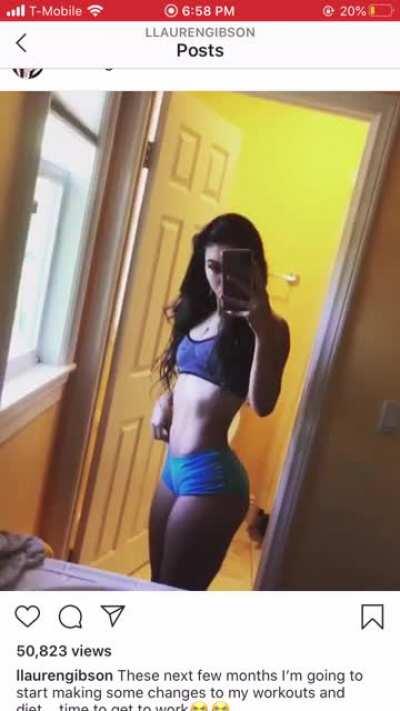 checking herself in the mirror