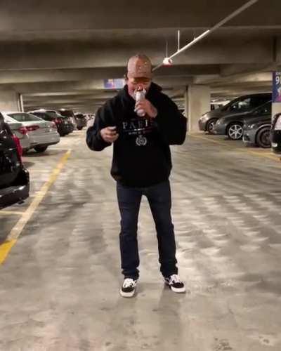 Attempting to do some sort of stunt involving a beer can...