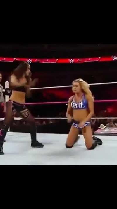 Brie kicking Charlotte making her squirm 
