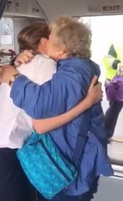 Woman realizing the captain of her flight is her Granddaughter