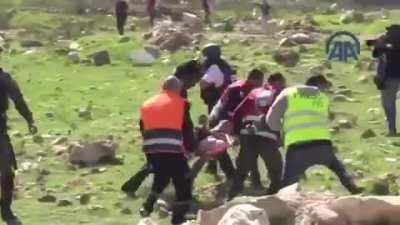 Footage of a soldier attacking paramedics who are trying to save an injured man