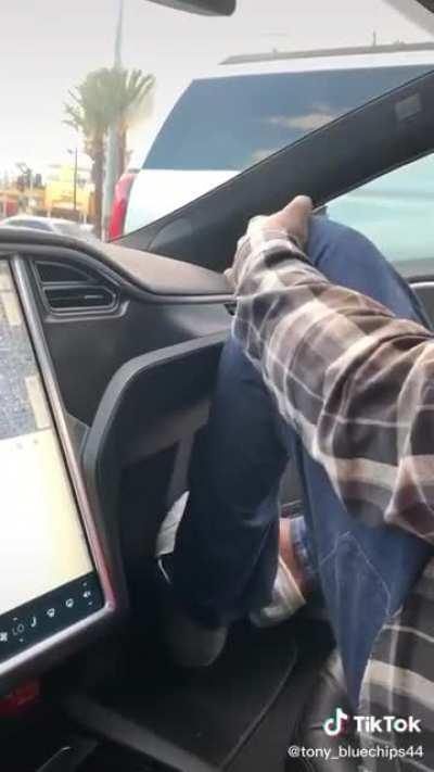 I bet you've never seen Shaq squeezing into a Tesla