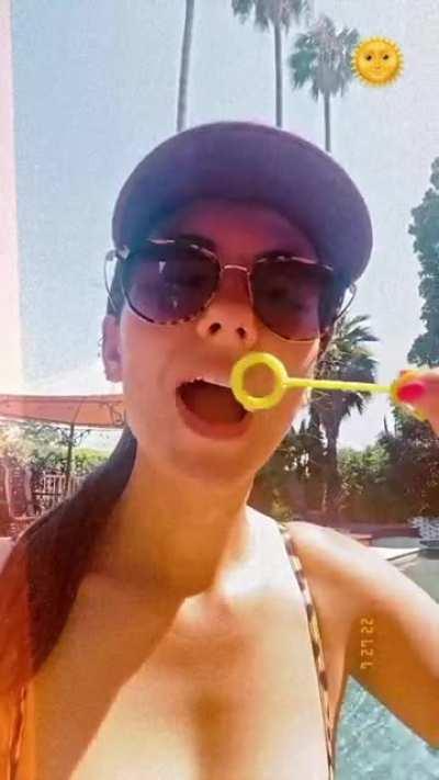 Victoria Justice Blowing bubbles