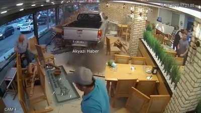 An idiot crashing into a restaurant with his car