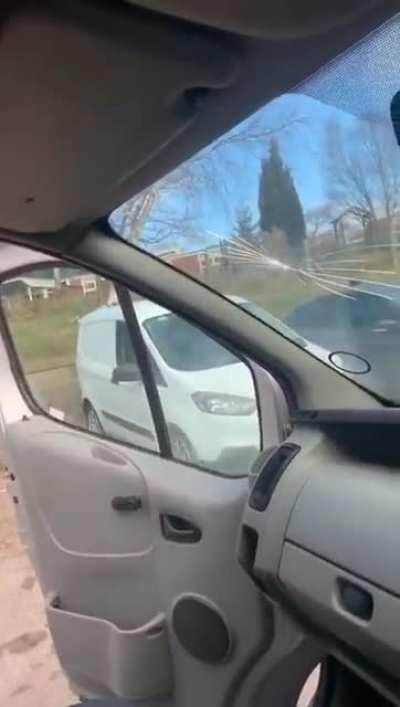 More concerned with his windshield than the lad's head!