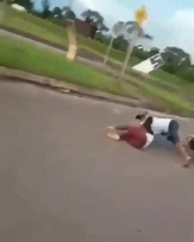 Stupid kids holding hands while doing a wheelie