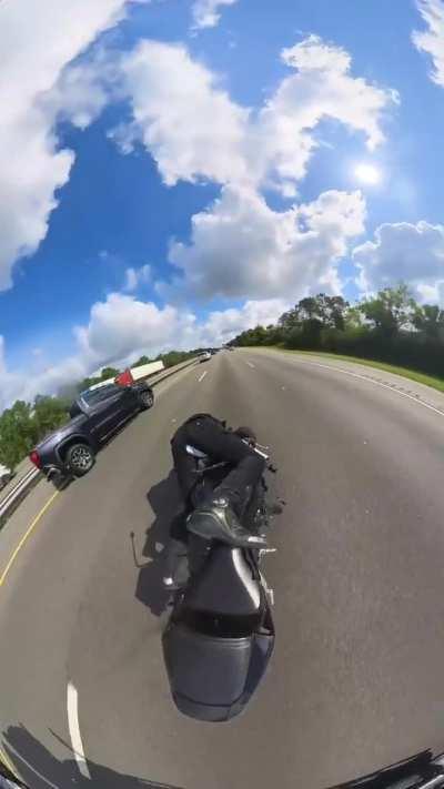 Idiot nearly kills himself speeding through traffic