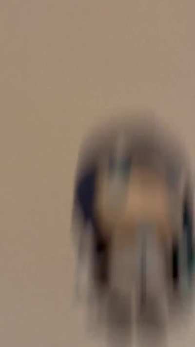 Ado throwing her plushie