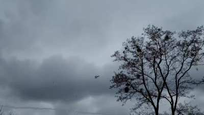 Fighter jets fly above a street somewhere in Ukraine. February 24th, 2022.