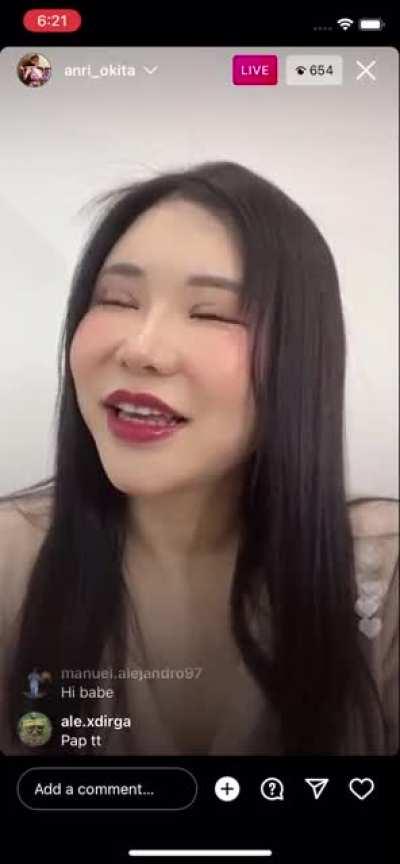 JAV actress Anri Okita leaning back to show massive breasts