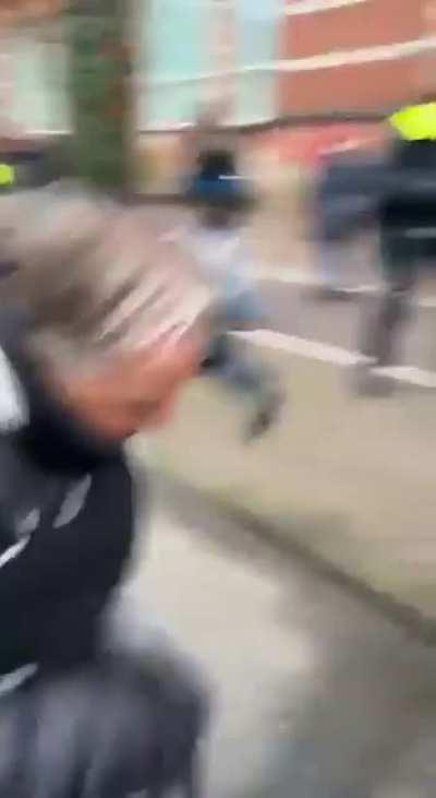 Guy tries to hit police officer twice at anti-vaccination protest, gets karma instead