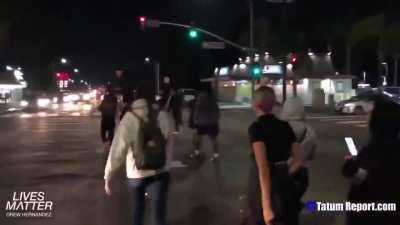 Following the death of that big guy who reached for his gun, the idiot squad is out protesting.